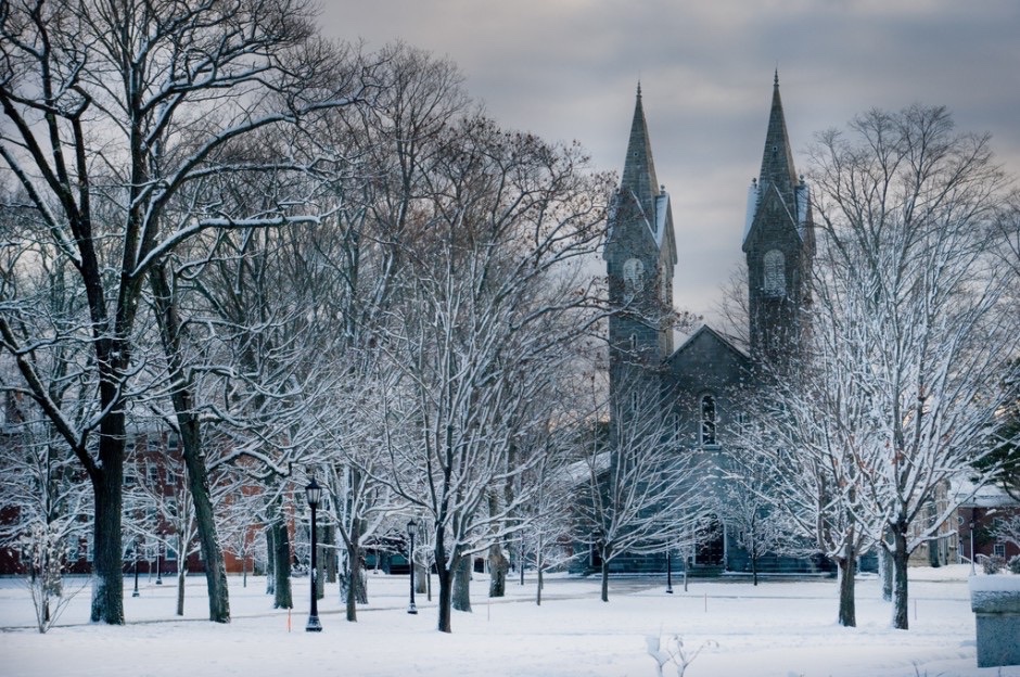 Bowdoin’s chapel after a snowstorm, its twin spires behind snow-covered trees